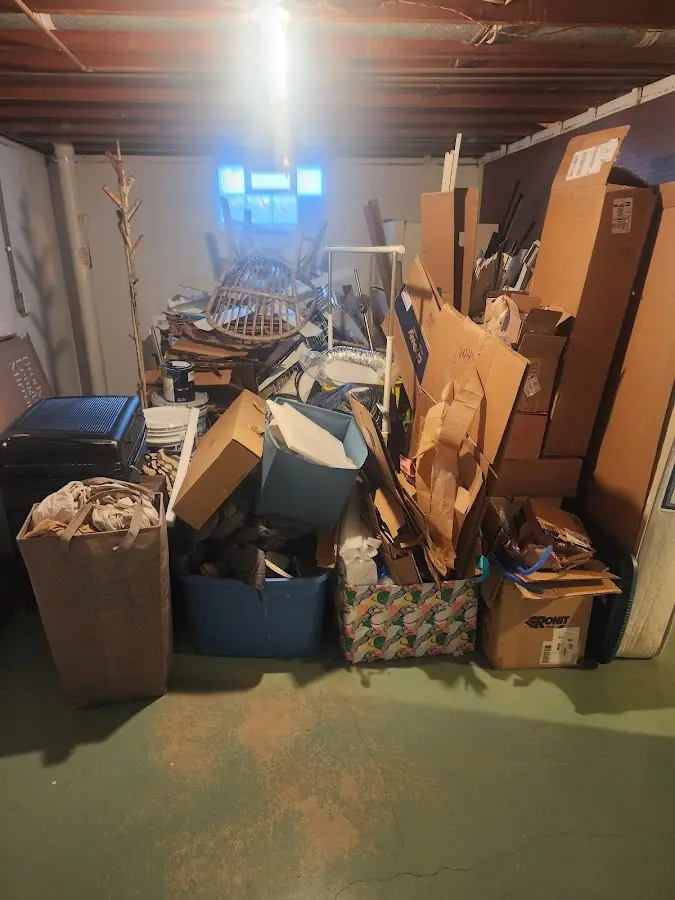 Roll-off dumpster container at job site for 2 Yard Dumpster Rental in Sergeant Bluff